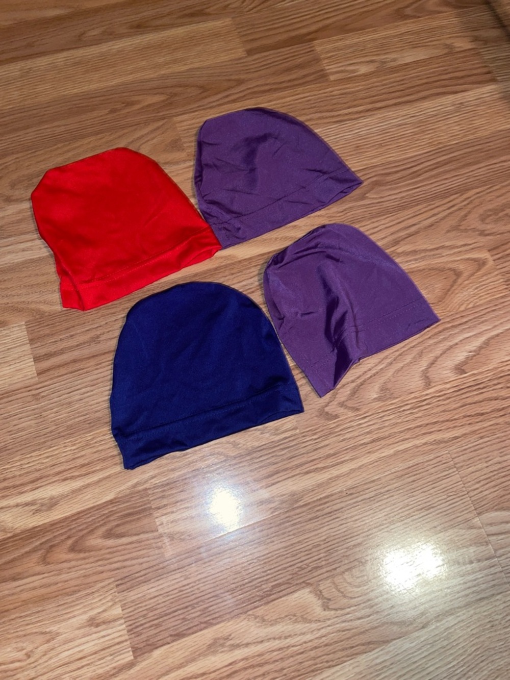 Four pack Women or Men Stretch Beanie Hat Pack - Red, Purple, Navy -